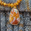 Queen Wingate Agate pendant on sweater