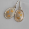 drop earrings with gold clovers