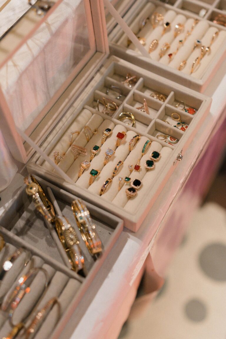 Organized jewelry drawer with neatly arranged earrings, rings, and necklaces for easy jewelry organization