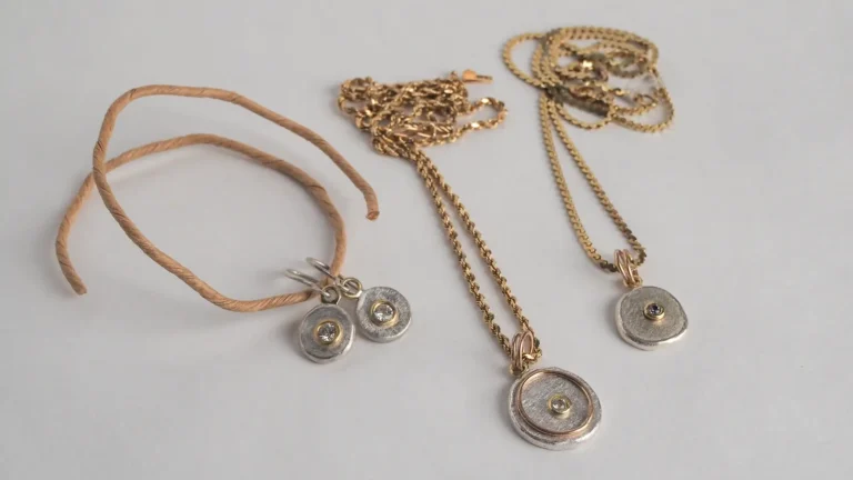 two pendants and a pair of earrings with Fairmined gold and Canadamark diamonds