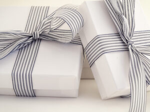 2 white gift boxes for jewelry hand tied with blue striped grosgrain ribbon