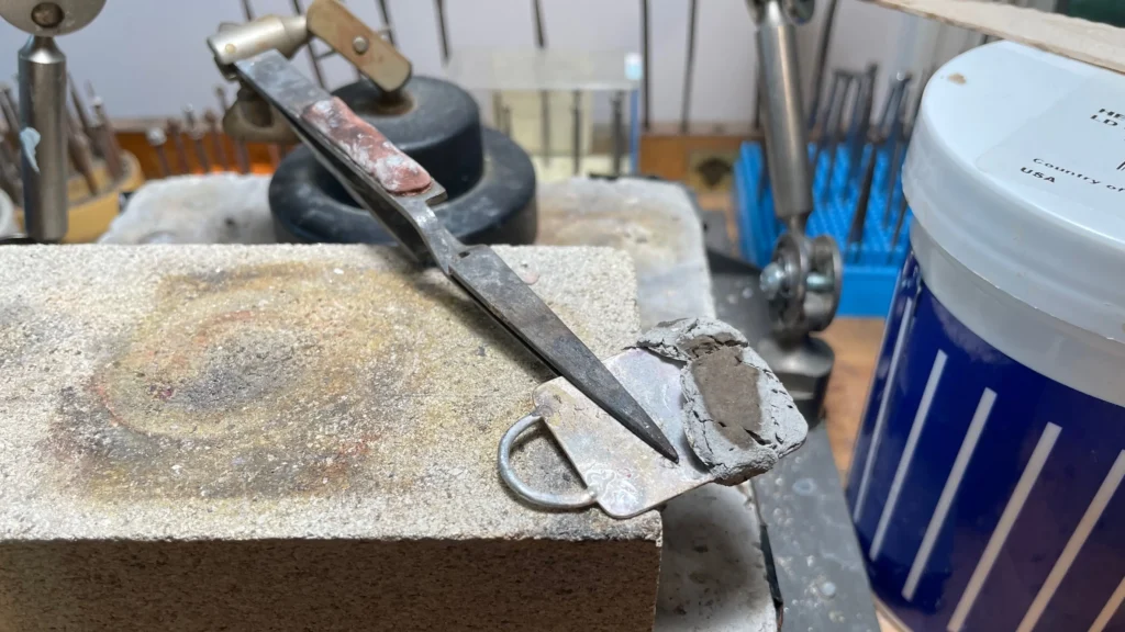 Keychain repair on jeweler's bench
