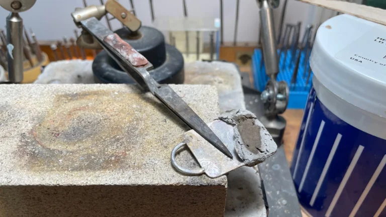 Keychain repair on jeweler's bench