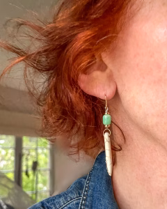 Green and white stone gold dangle earrings